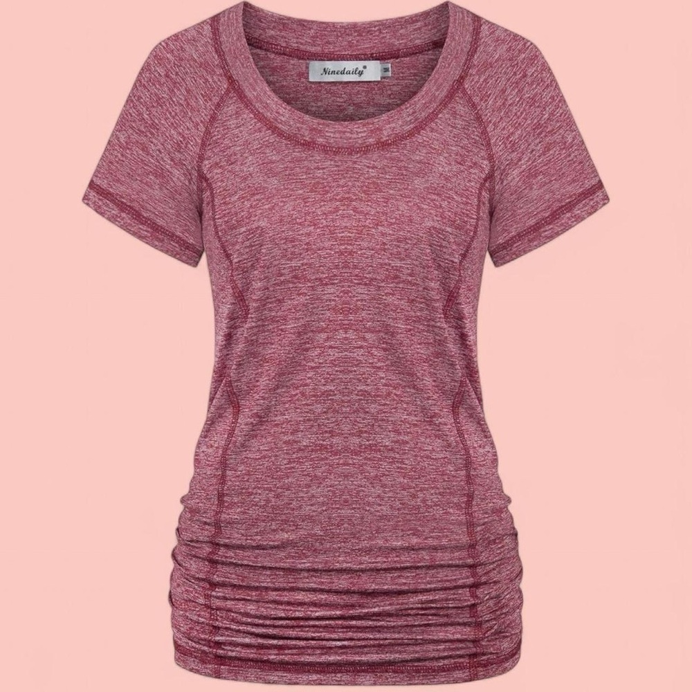 Women's red/burgundy sportswear top with open back detail